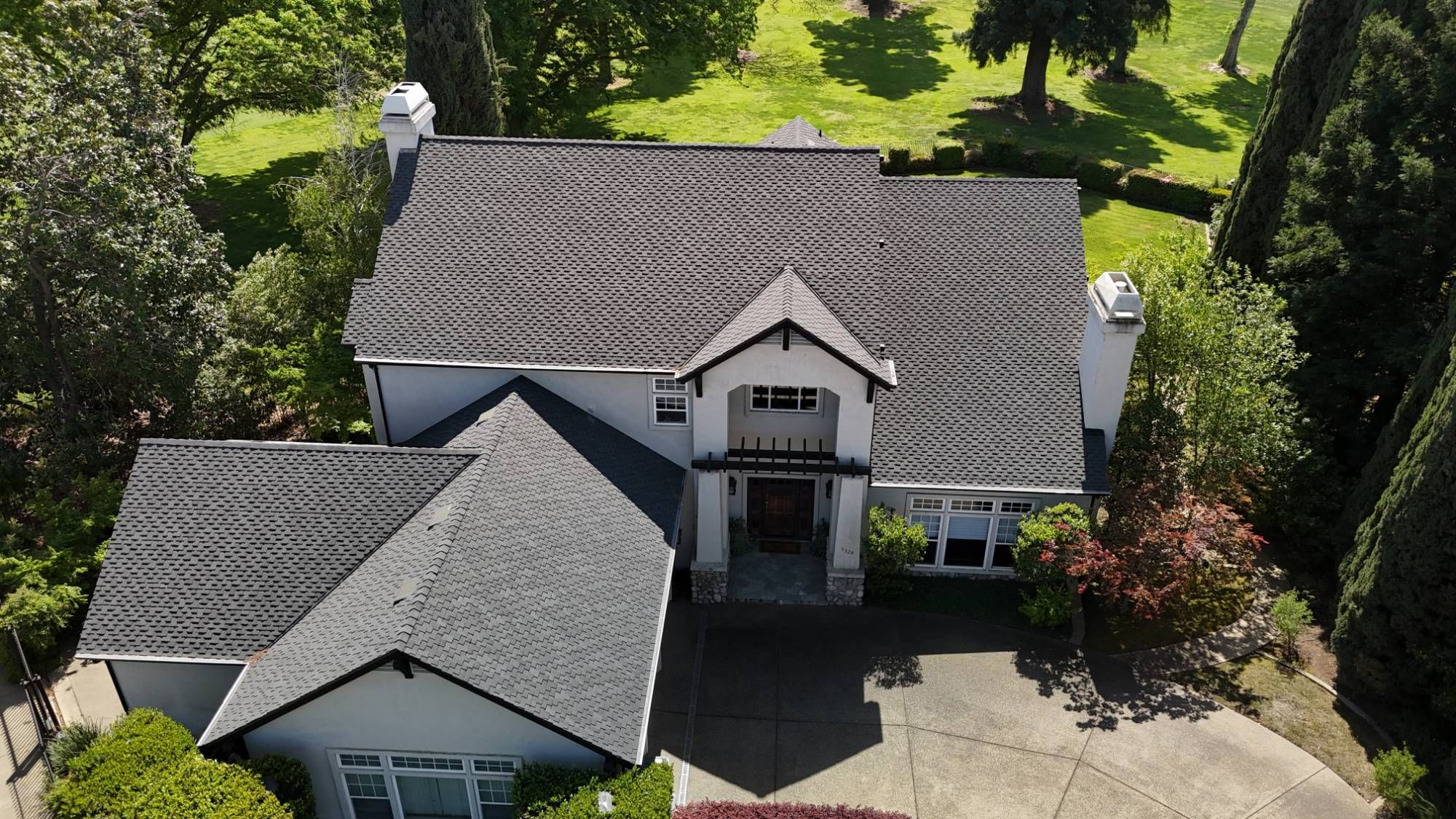 Aerial view of a Fair Oaks home with a new CertainTeed Presidential Shake TL roof by GM Roofing