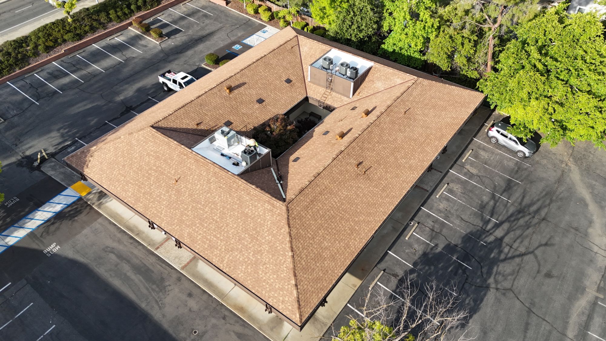Angled aerial view of the finished Resawn Shake roof on a Fair Oaks commercial building
